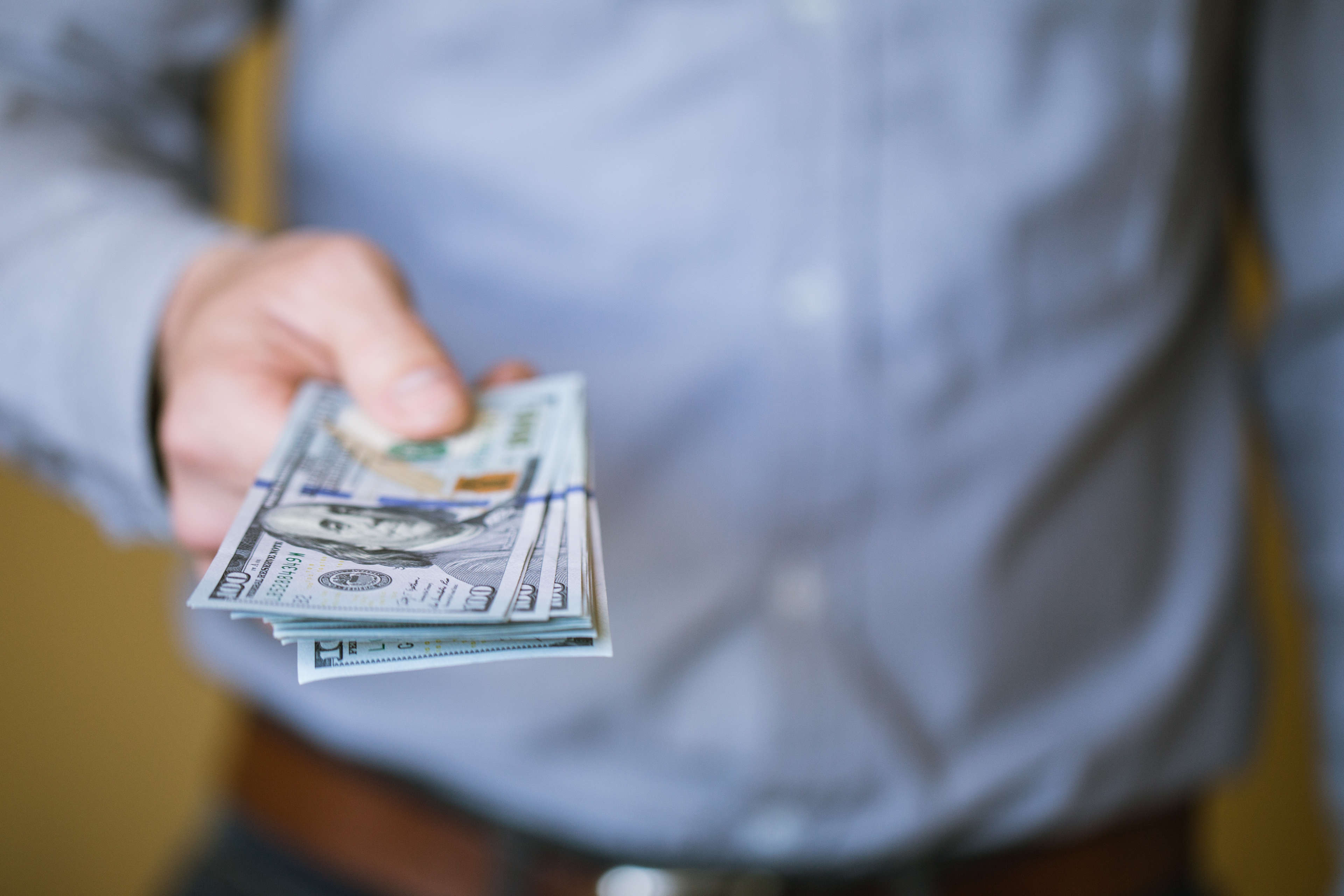 man holding cash