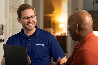 Indiana Foundation Service inspector meeting with a homeowner