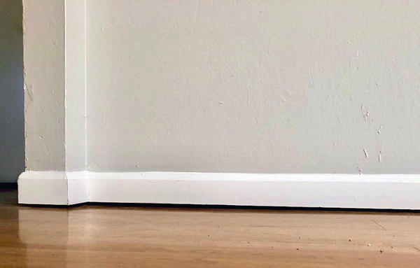 Gap Between Wall and Floor: What Causes Floor Gaps?