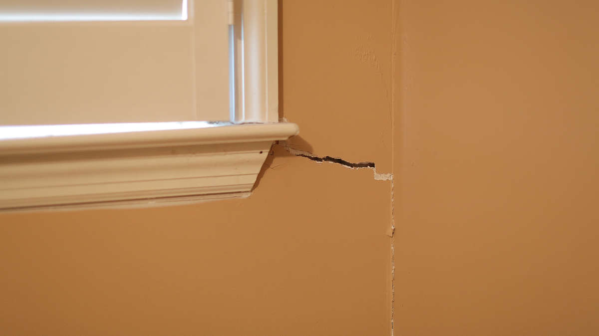 drywall crack on interior wall corner near window
