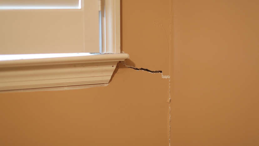 interior drywall crack near window frame