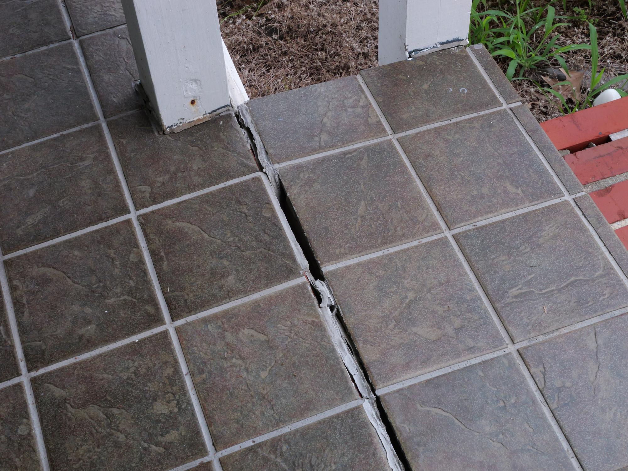 cracked concrete step on porch