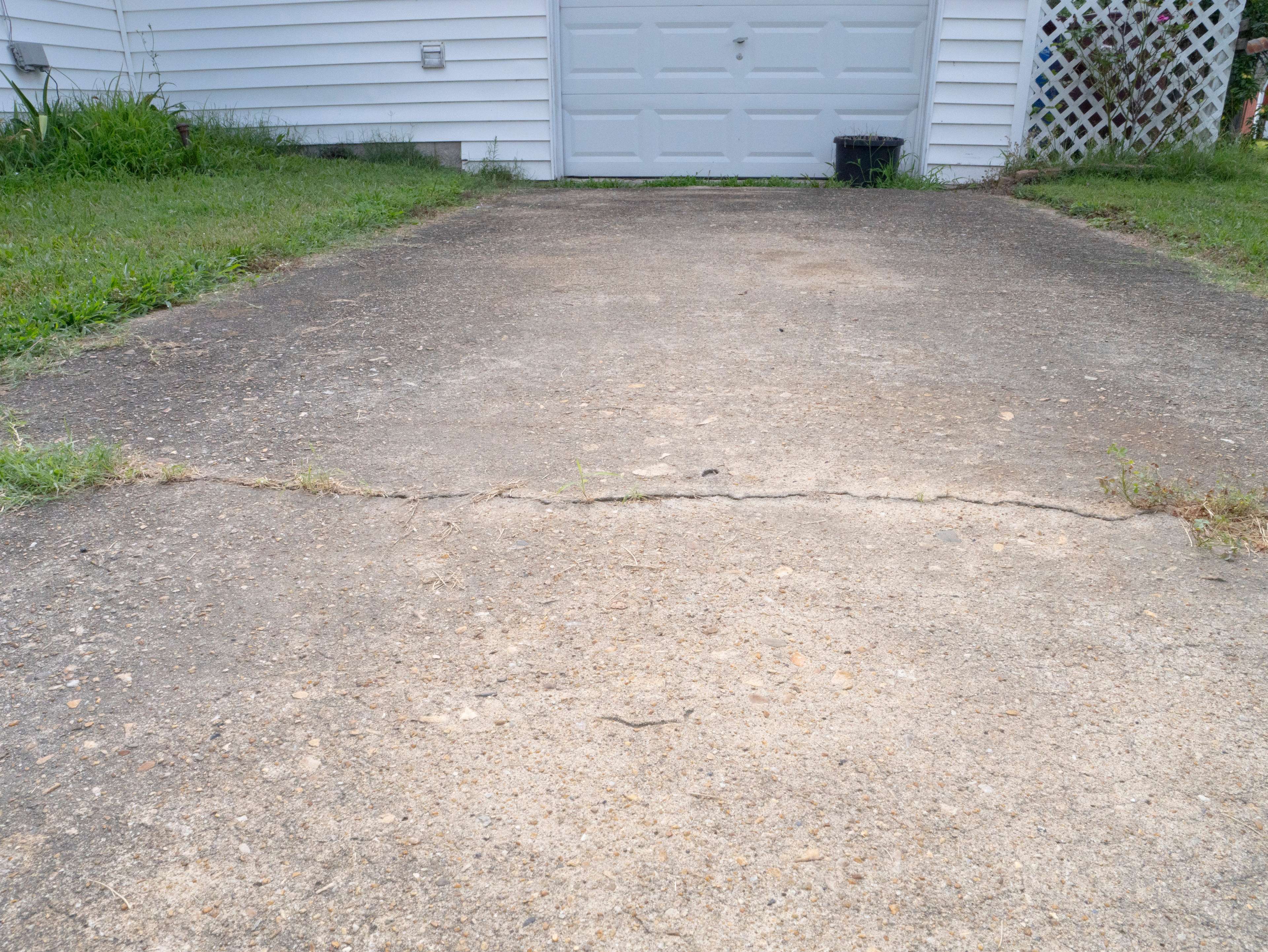 horizontal crack in concrete driveway