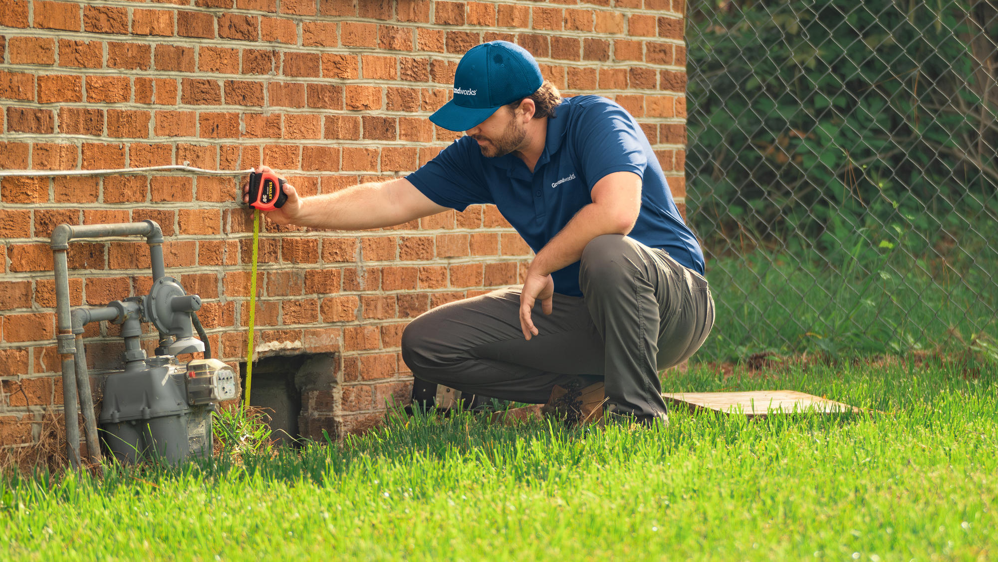 JES Foundation Repair crew measuring foundation