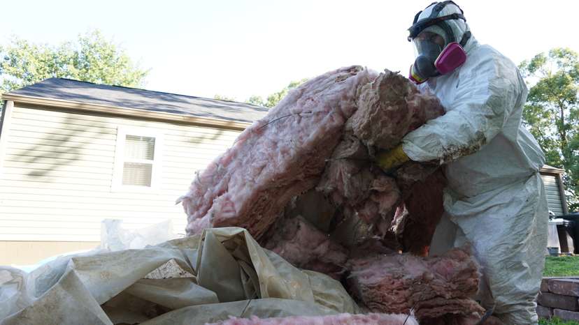 Removal of old crawl space insulation.