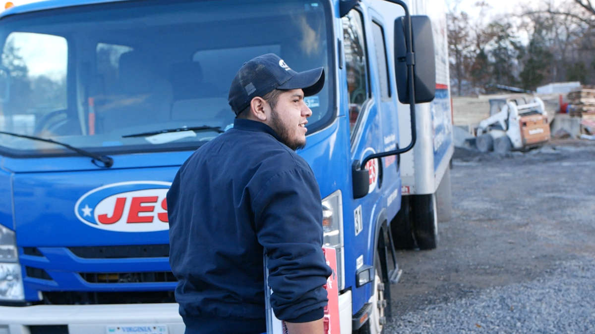 JES crew member by truck