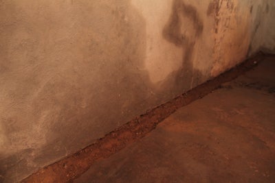 Damp wall and floor.