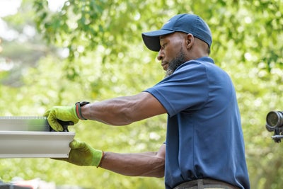 Crewman checking gutters.