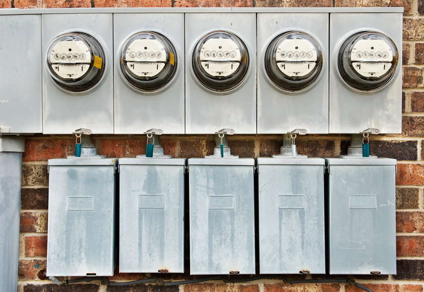 Energy gauges on a brick wall.