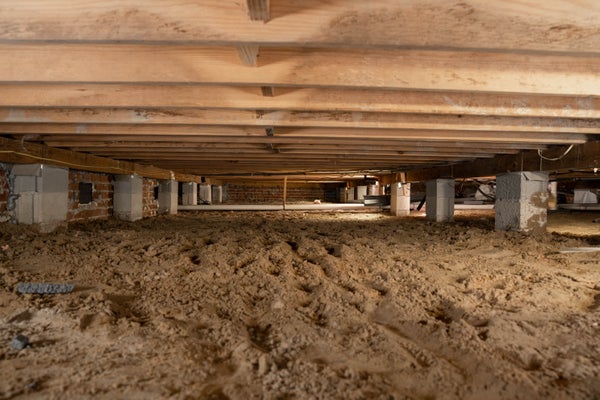 closeup image of indoor wood floor joists