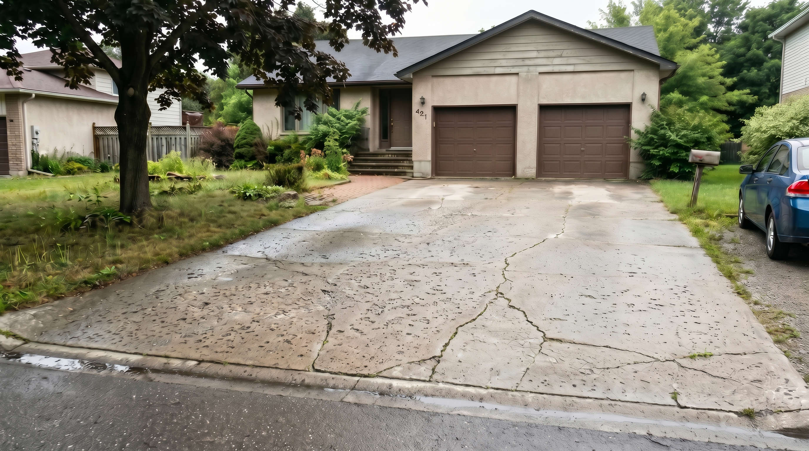 cracking and pitting concrete driveway