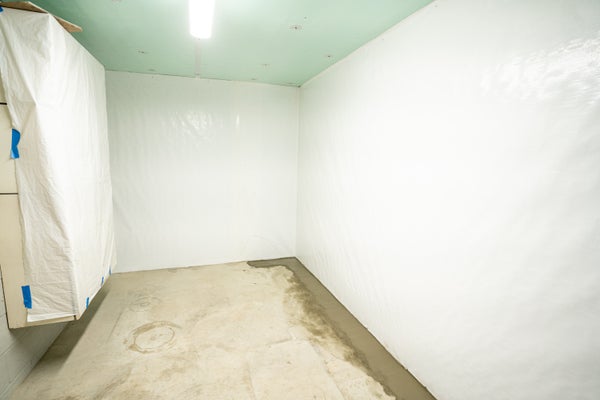 waterproofed basement with vapor barrier on walls