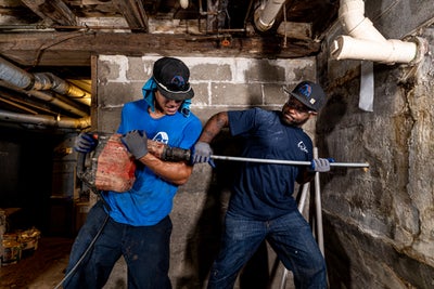 FSM team installing wall anchors