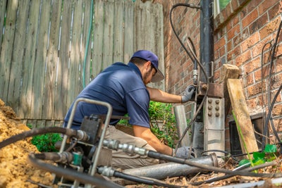 crew member installing push piers