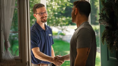 Tar Heel Basement Systems inspector shaking a homeowner's hand