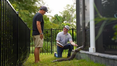Inspector walking homeowner through an inspection.