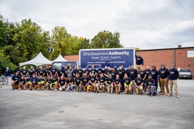 Ohio Basement Authority team standing in front of work truck