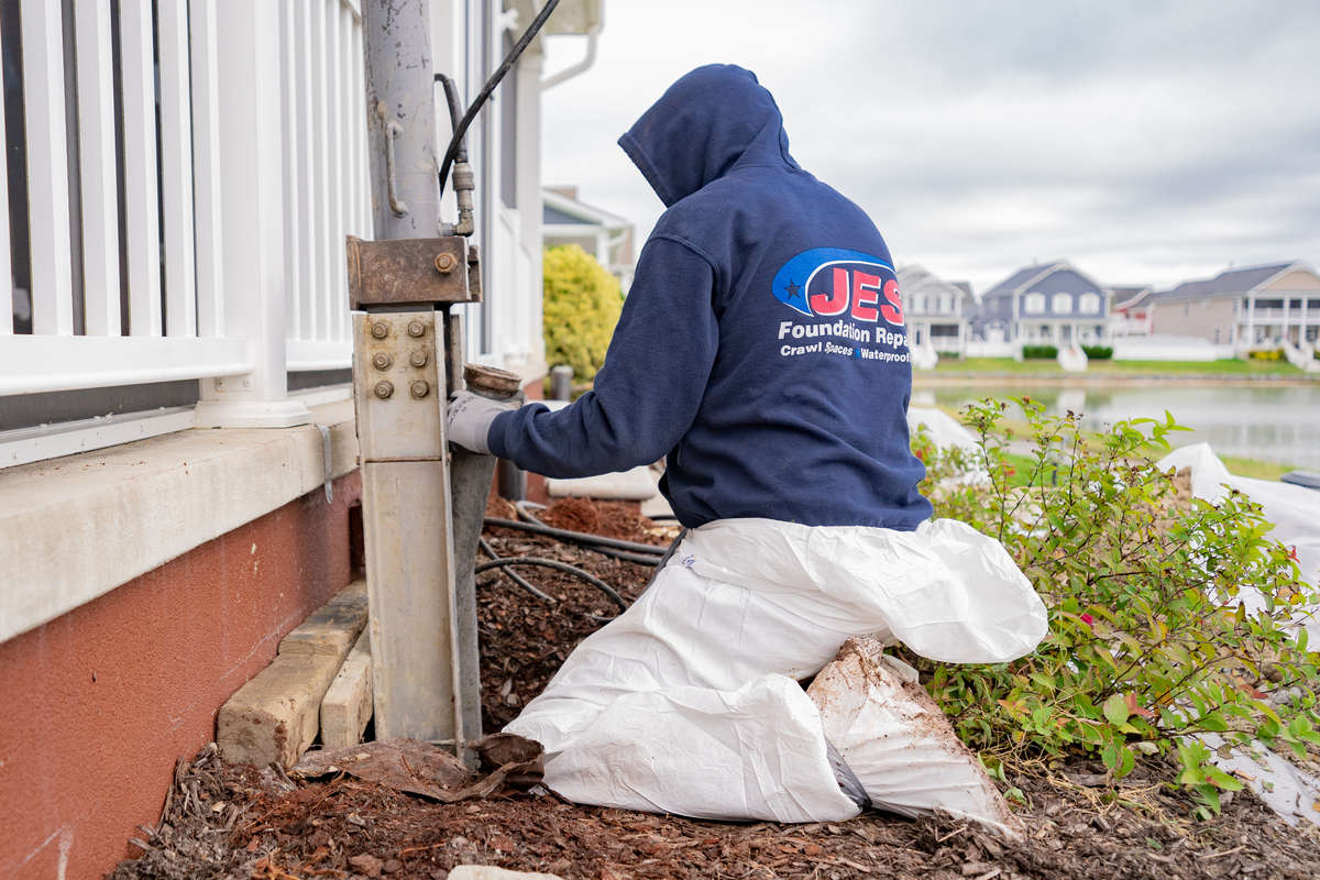 JES technician installing a foundation pier.