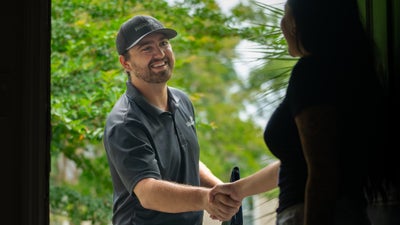 Mount Valley Foundation Services inspector shaking a homeowner's hand