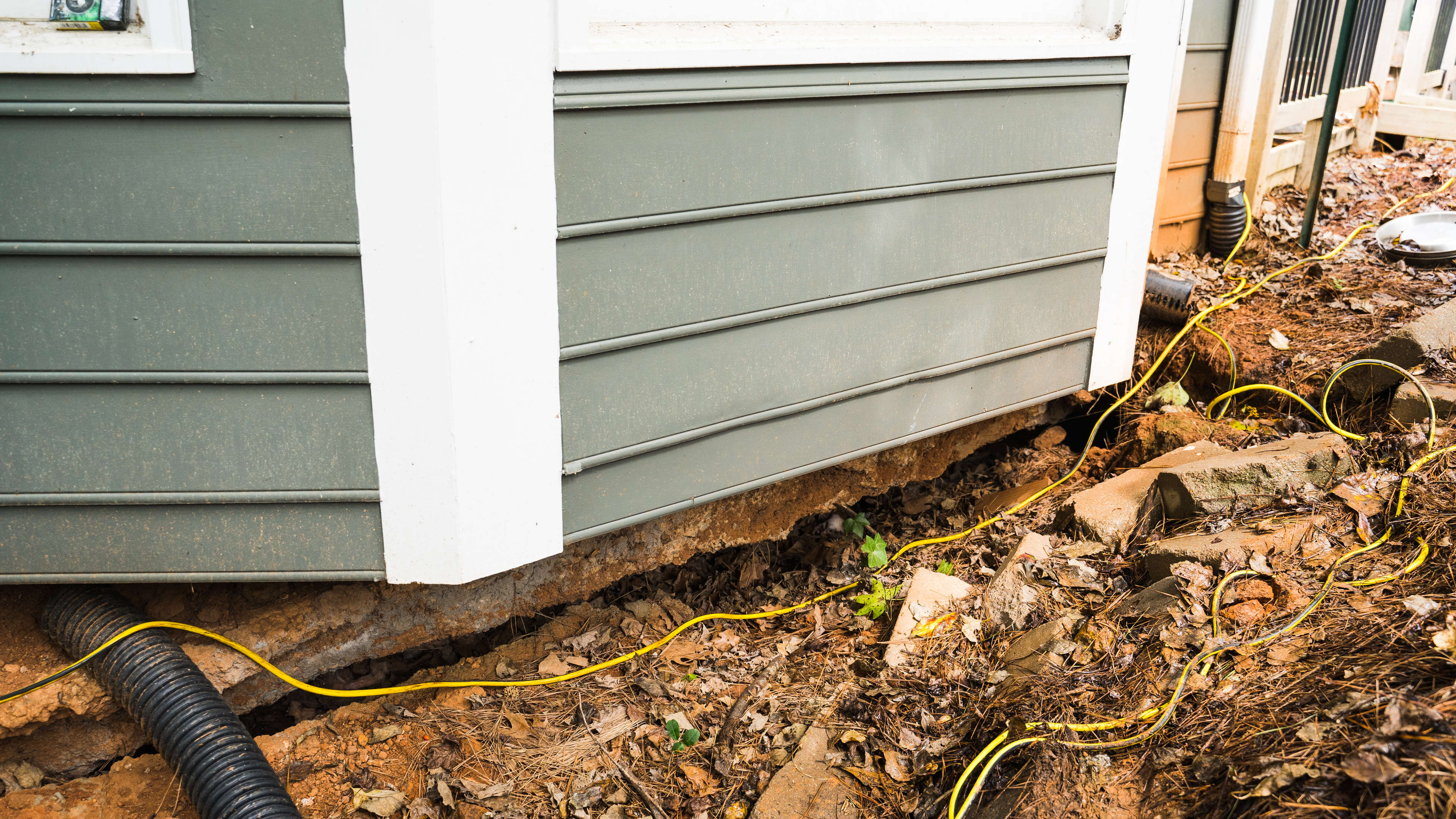 signs of sinking around the base of a foundation