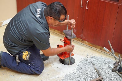 AFS crew member installing a slab pier