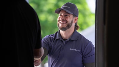 Groundworks inspector shaking hands with a homeowner