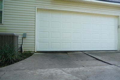 Sinking concrete driveway.