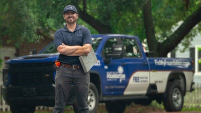 Mount Valley Foundation Services inspector standing in front of a company vehicle