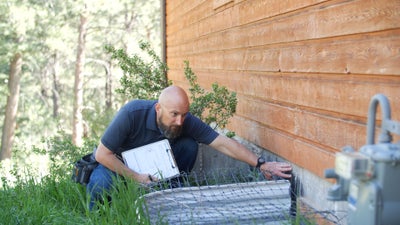 man inspecting a foundation