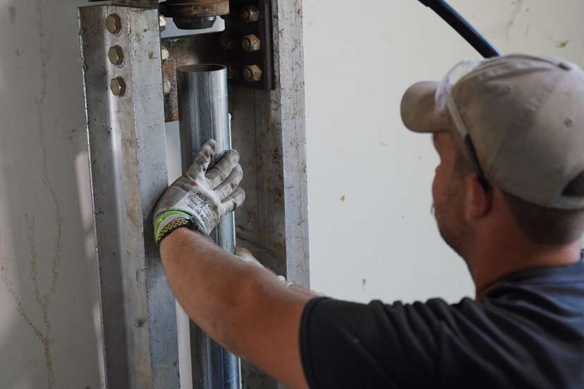 crew member installing push piers