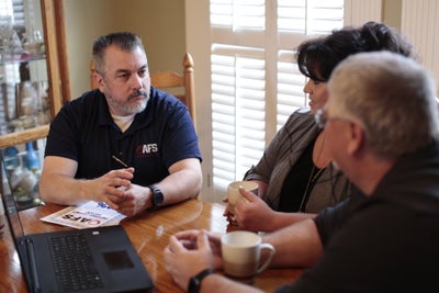 AFS inspector meeting with homeowners.