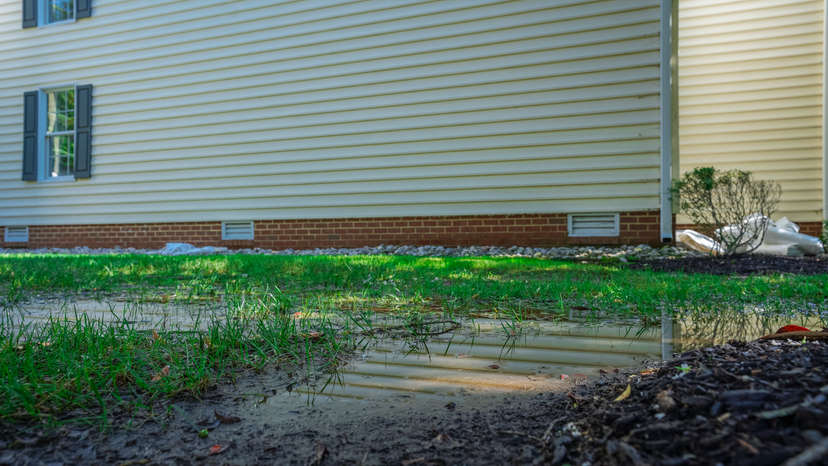 yard flood near concrete slab foundation