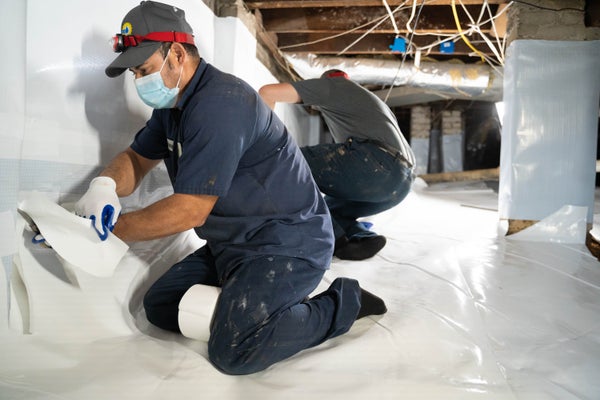 Dry Pro expert installing crawl space encapsulation