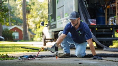 Alpha Foundations crewman installing polyurethane foam.