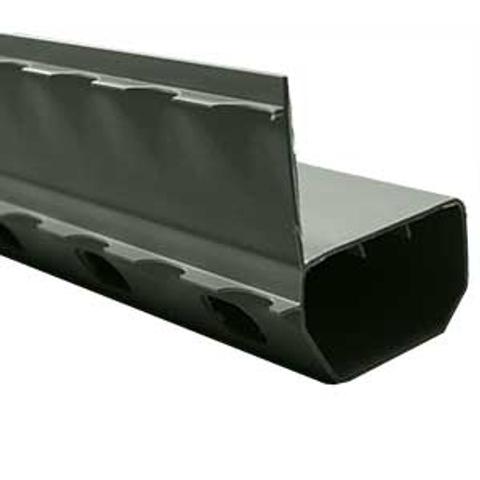Close-up of a green, hollow rectangular metal tube with perforated sides and a top extending edge.