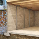 Cross-section of a building foundation with concrete walls, beams, and visible soil layers.