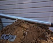 Close up Push pier sitting on soil mount outside.