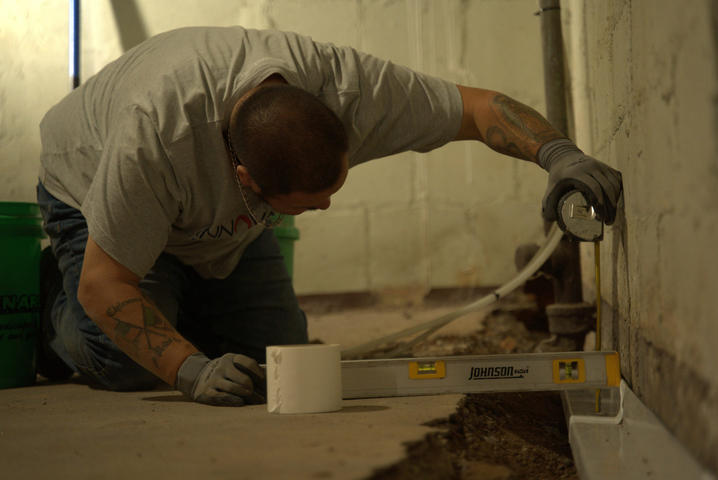 IBA Crew installing Basement gutter guard.