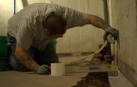 IBA Crew installing Basement gutter guard.