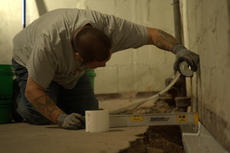 IBA Crew installing Basement gutter guard.