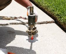 Leveling concrete with poly injection.