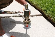 Leveling concrete with poly injection.