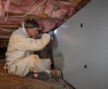 IBA's CFI is installing crawlspace insulation.