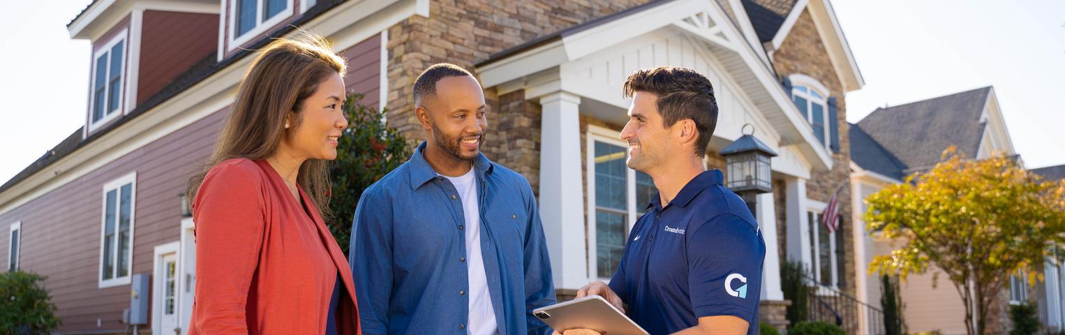 Innovative Basement Authority CFI with couple in front of house - desktop hero