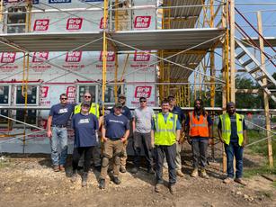 IBA and Habitat for Humanity volunteers; project's exterior.