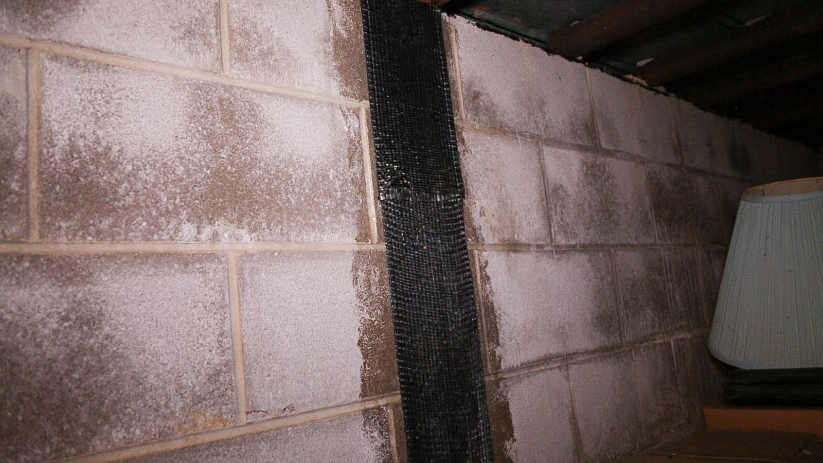 Closeup of installed carbon fiber basement repair