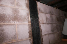 Closeup of installed carbon fiber basement repair