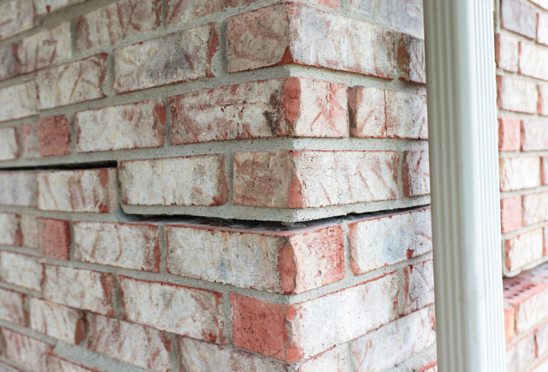 Horizontal crack on an exterior brick foundation.