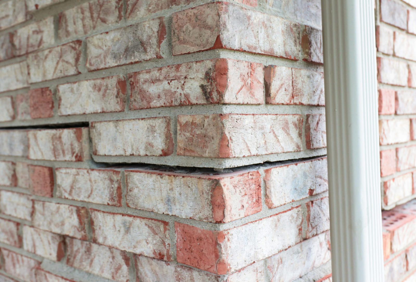 Horizontal crack on an exterior brick foundation.