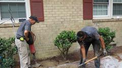 Crew digging and grading front yard.